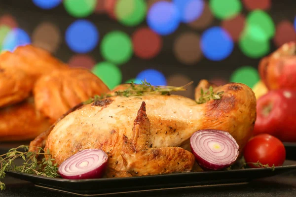Tasty baked turkey for Thanksgiving day on table against blurred lights — Stock Photo, Image