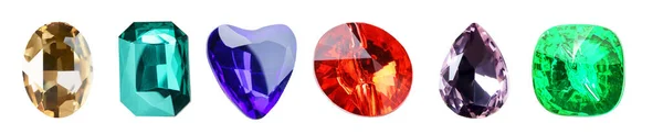 Diferentes piedras preciosas para joyas sobre fondo blanco —  Fotos de Stock