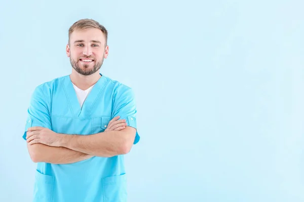 Portrait of male doctor on light background — Stock Photo, Image