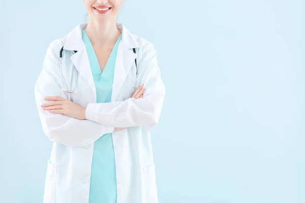 Female doctor on light background — Stock Photo, Image