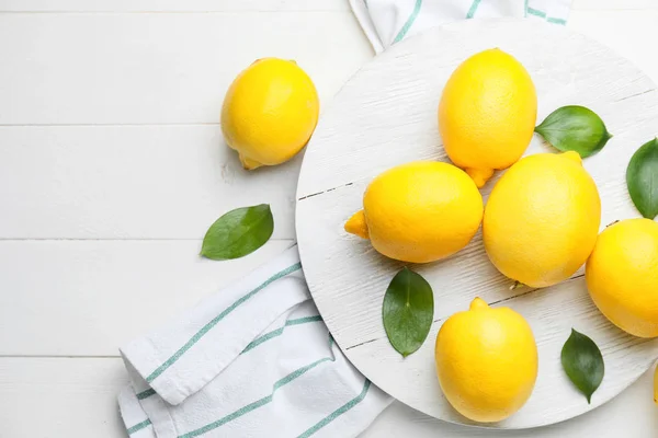 Fresh ripe lemons on white table — Stock Photo, Image