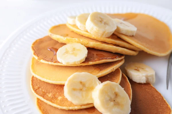Plate with tasty pancakes and banana on table, closeup — Stock Photo, Image