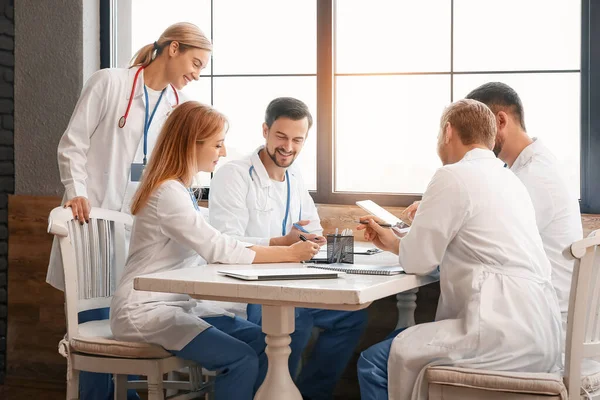 Doctors at meeting in modern clinic