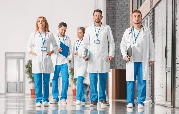 Portrait of doctors in corridor of modern clinic — Stock Photo, Image