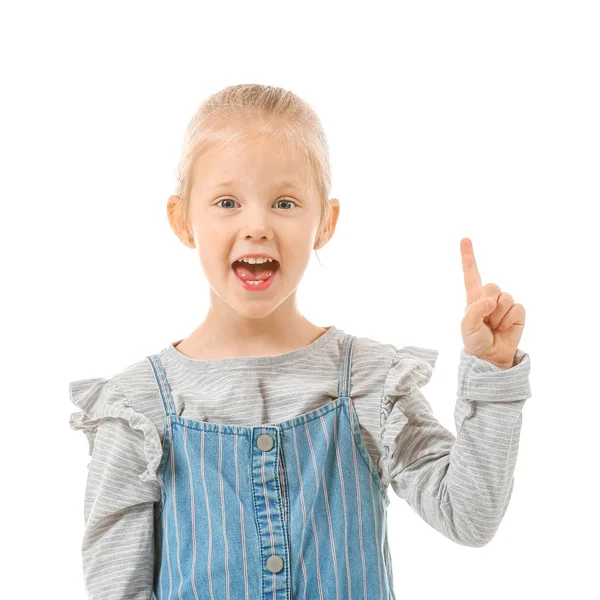 Nettes kleines Mädchen mit erhobenem Zeigefinger auf weißem Hintergrund — Stockfoto