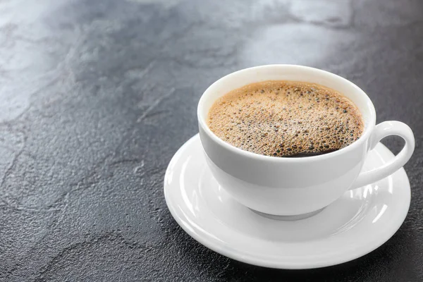 Cup of hot coffee on grey background — Stock Photo, Image