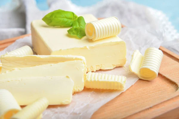 Fresh butter on wooden board — Stock Photo, Image