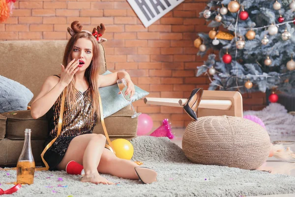 Young woman with hangover after New Year party at home — Stock Photo, Image