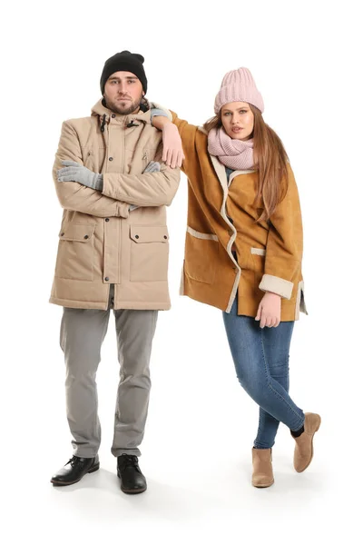 Portrait of serious couple in winter clothes on white background — Stock Photo, Image