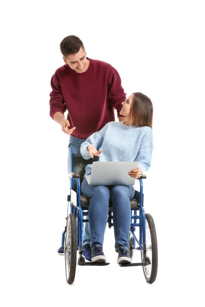 Mujer joven discapacitada con portátil y su marido sobre fondo blanco — Foto de Stock