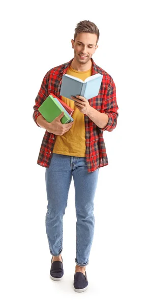 Bello giovane uomo con libri su sfondo bianco — Foto Stock