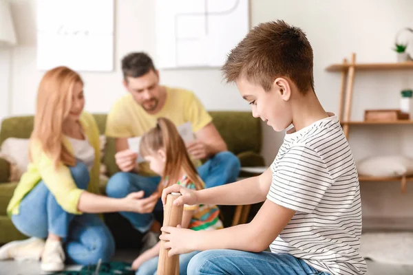 Family assembling furniture at home — Stock Photo, Image