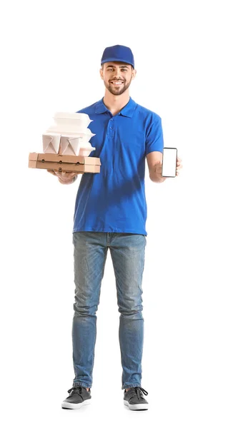 Handsome worker of food delivery service with mobile phone on white background — 스톡 사진