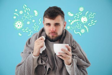 Portrait of sick man with hot tea on color background clipart
