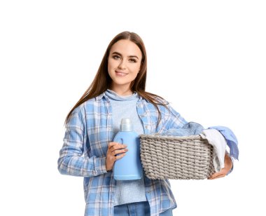 Beautiful young woman with laundry on white background