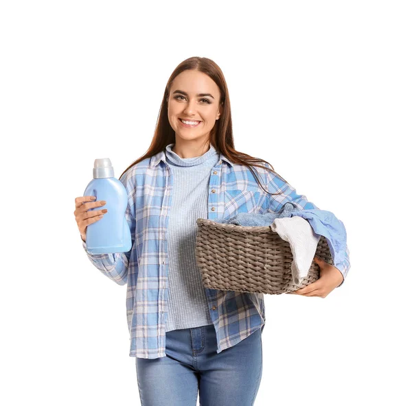 Beautiful young woman with laundry on white background