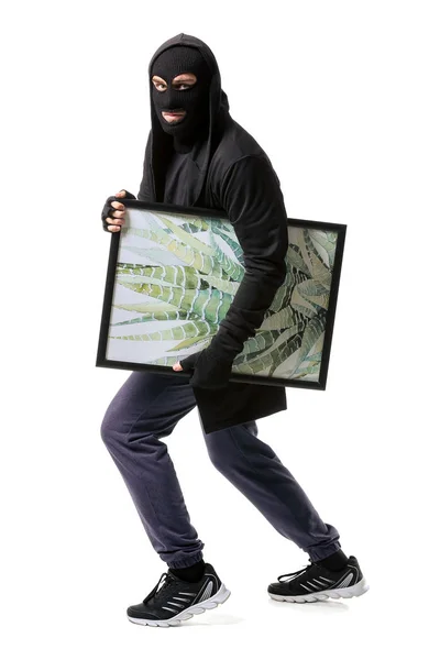 Ladrão com foto roubada da galeria de arte em fundo branco — Fotografia de Stock