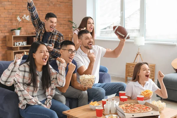 Group of fans watching rugby on TV — Stock Photo, Image