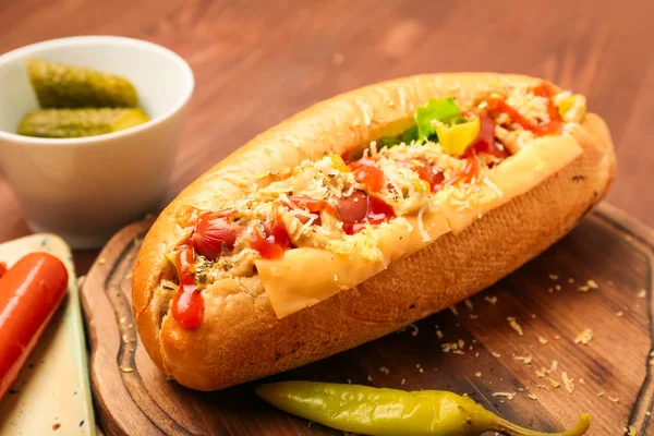 Tasty hot dog on table — Stock Photo, Image