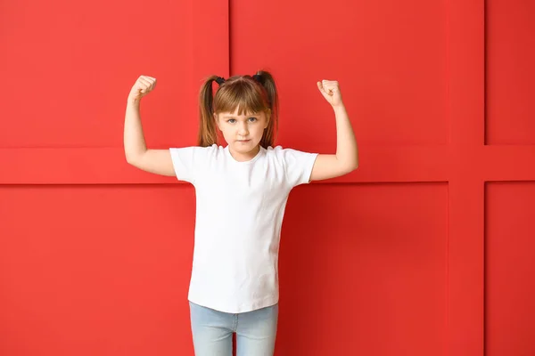 Strong little girl on color background. Concept of feminism — 스톡 사진