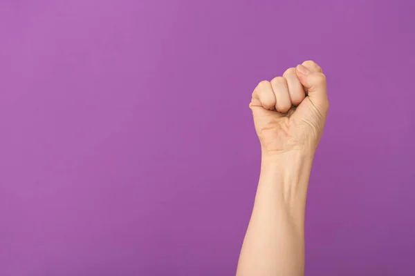 Hand of woman with clenched fist on color background — Stock Photo, Image