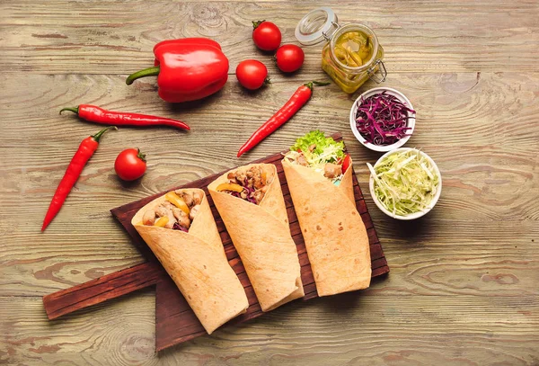 Composition with tasty doner kebab on wooden background — Stock Photo, Image