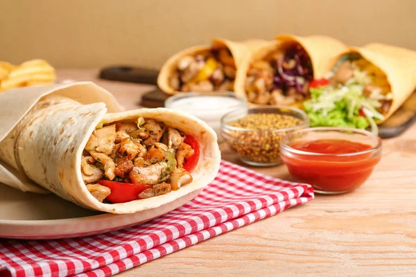 Tasty doner kebab on wooden table — Stock Photo, Image