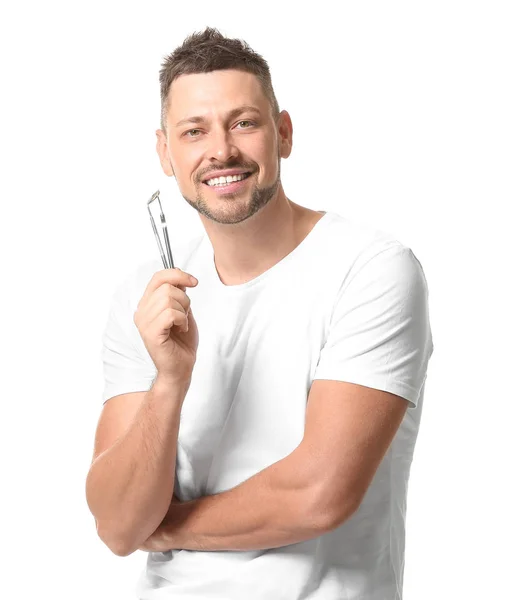 Hombre con herramientas dentales sobre fondo blanco — Foto de Stock