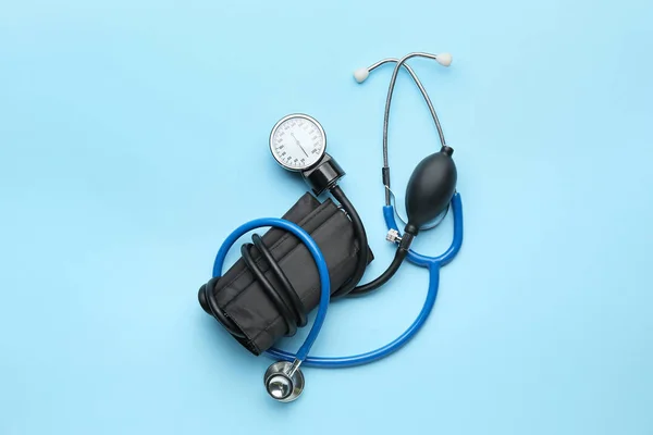 Modern sphygmomanometer on color background — Stock Photo, Image