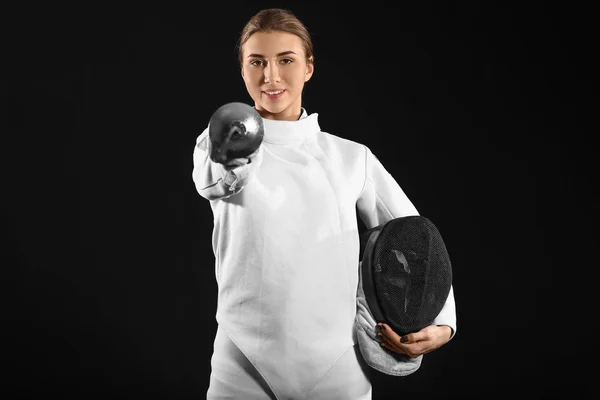 Young female fencer on dark background — Stock Photo, Image