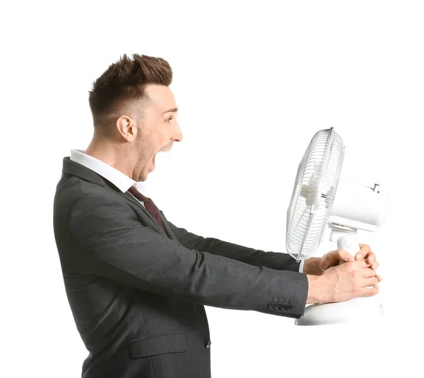 Hombre feliz con ventilador eléctrico sobre fondo blanco —  Fotos de Stock