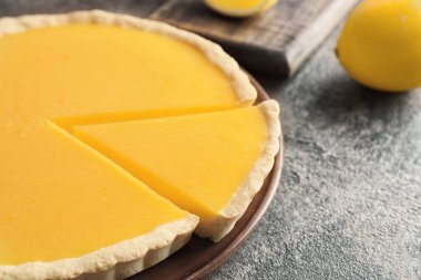 Tasty homemade lemon pie on table, closeup