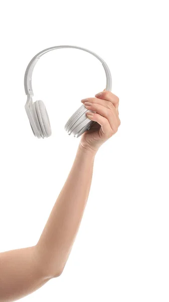 Hand with modern headphones on white background — Stock Photo, Image