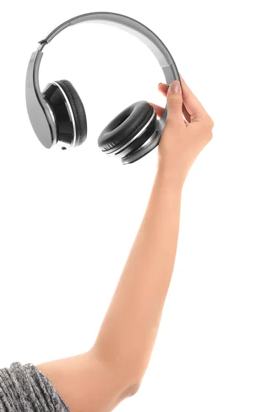 Mano con auriculares modernos sobre fondo blanco — Foto de Stock