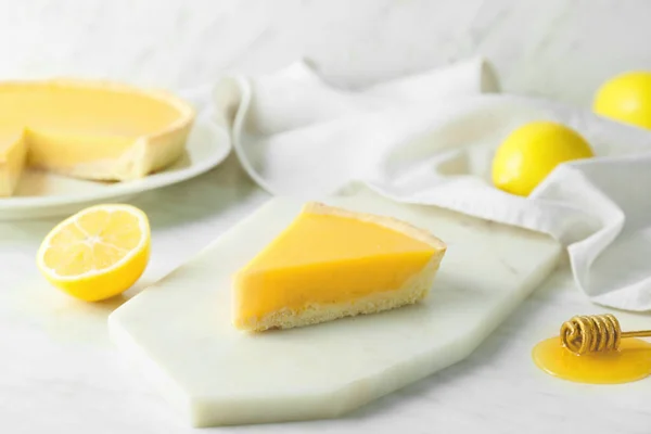 Slice of tasty homemade lemon pie on table — Stock Photo, Image
