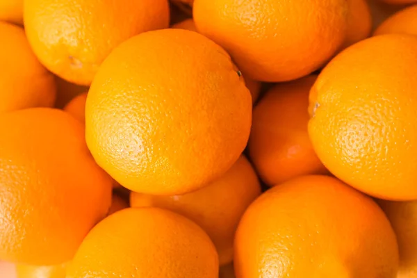 Many tasty oranges as background — Stock Photo, Image