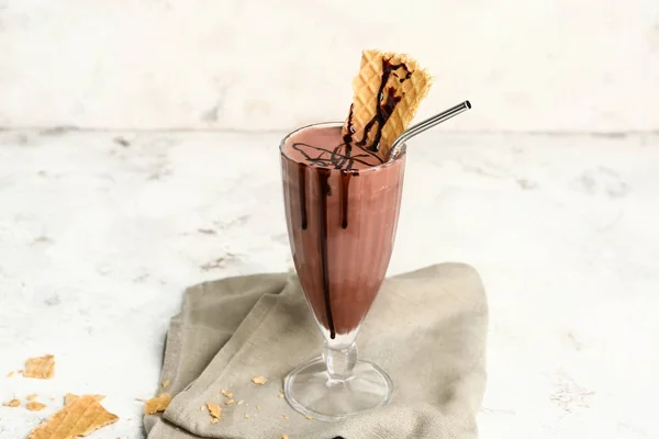 Glass of tasty milkshake on white background — Stock Photo, Image