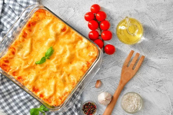 Tasty lasagna on grey background — Stock Photo, Image