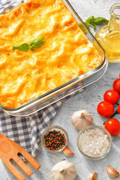 Tasty lasagna on grey background — Stock Photo, Image