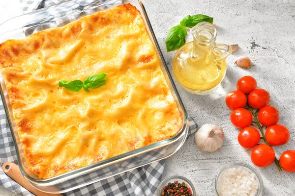 Tasty lasagna on grey background — Stock Photo, Image