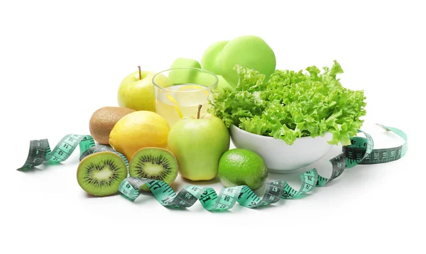 Different healthy food with measuring tape on white background. Diet concept — Stock Image Different healthy food with measuring tape on white background. Diet concept Royalty Free Stock Images