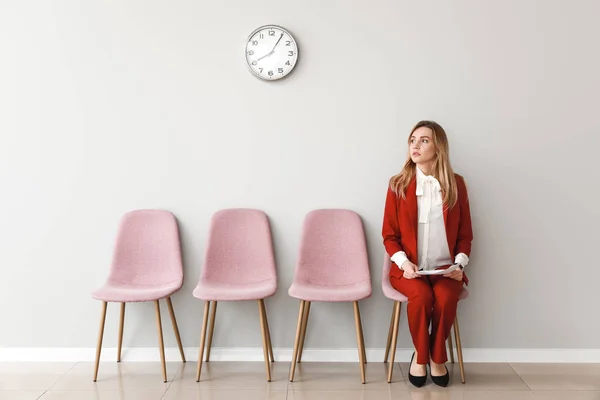 Young woman waiting for job interview indoors — Stock Photo, Image