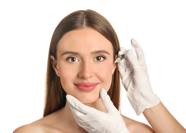 Young woman receiving filler injection against white background — Stock Photo, Image