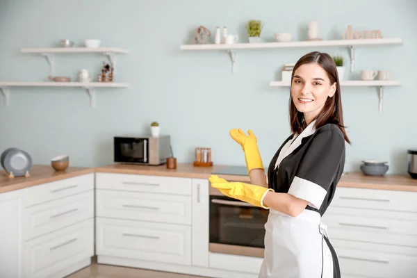 Portrait of beautiful young chambermaid in kitchen — Stock Photo, Image