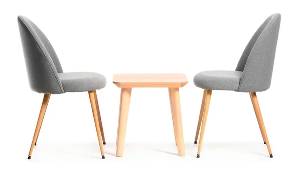 Modern chairs and table on white background — Stock Photo, Image