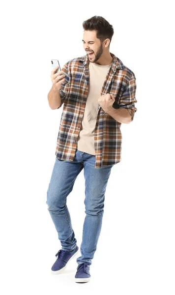 Screaming young man with mobile phone on white background — Stock Photo, Image