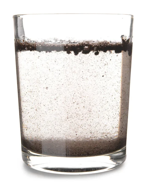 Glass of dirty water on white background — Stock Photo, Image