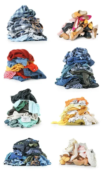 Montes de roupas e sapatos diferentes no fundo branco — Fotografia de Stock