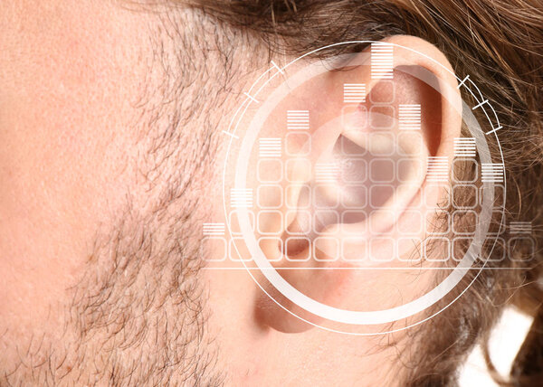 Young man with hearing problem, closeup
