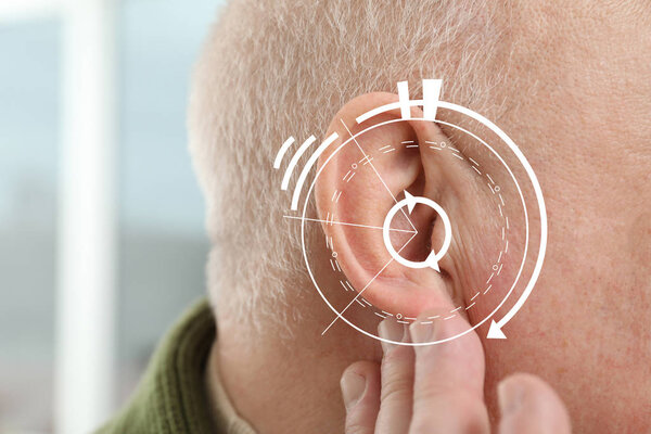 Senior man with hearing problem, closeup